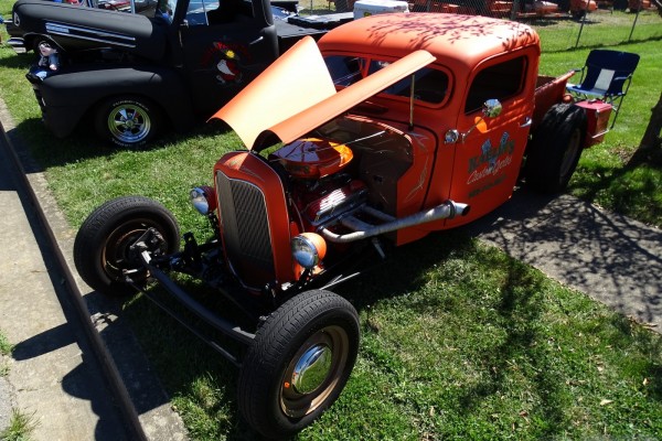 orange chevy v8 powered ford hot rod truck