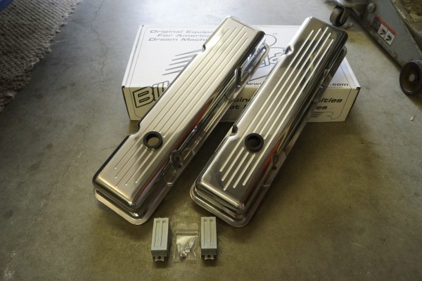 pair of new valve covers on garage floor