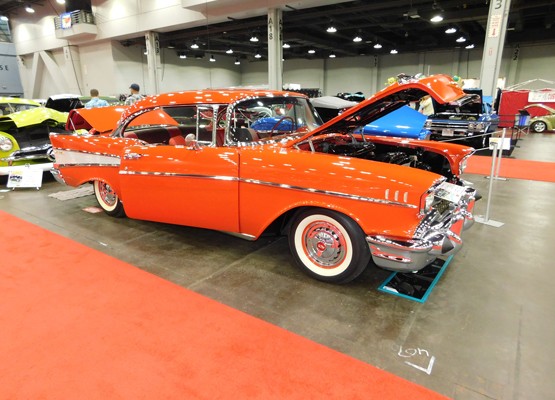red 1957 chevy bel air coupe at indoor car show