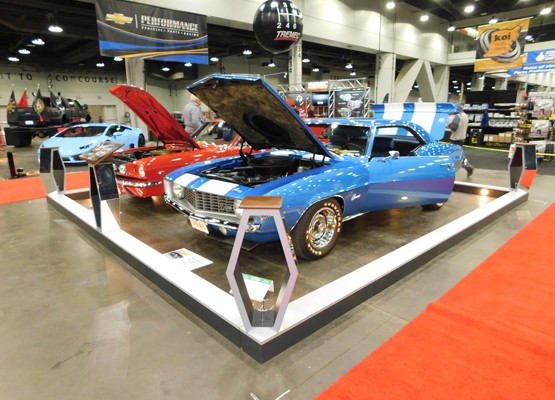 blue and white chevy camaro at car show