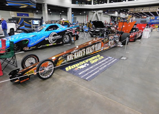 rail dragster on display at car show