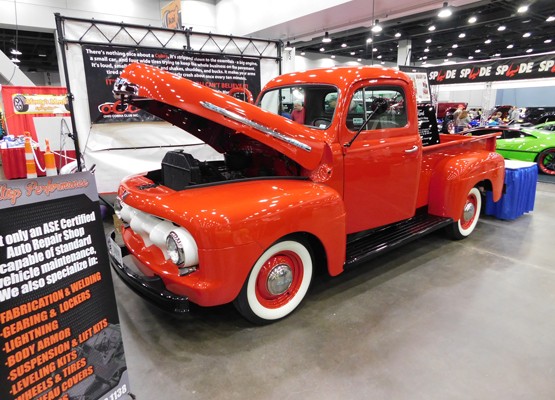 red ford vintage pickup truck at car show