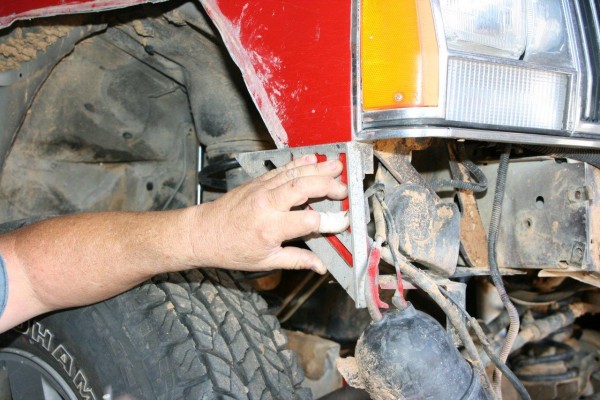 checking cutting template for bumper install on an xj cherokee