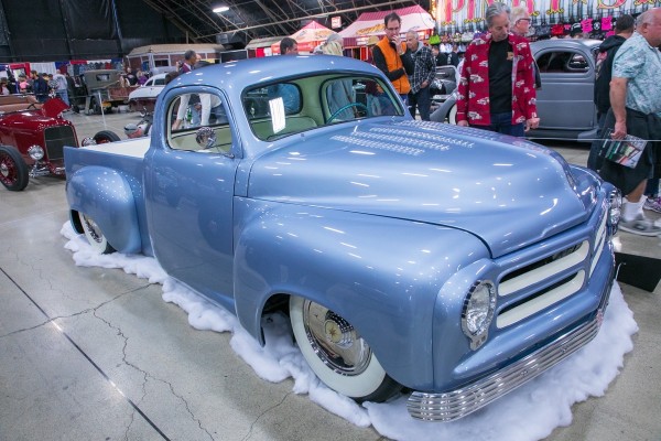 customized blue vintage pickup truck at car show