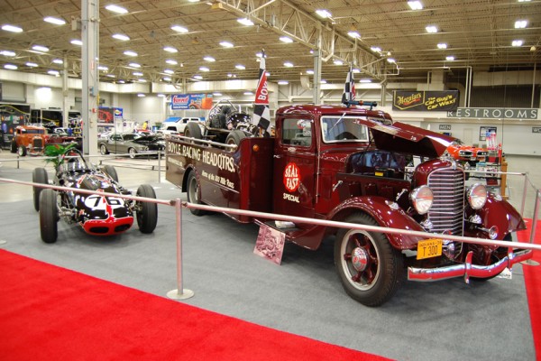 vintage formula race car and semi truck flatbed hauler