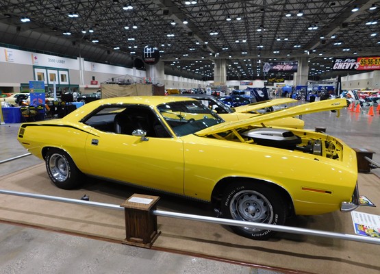 yellow plymouth barracuda at car show