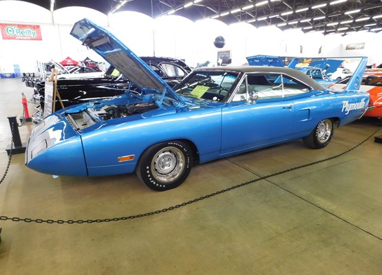 blue plymouth superbird at car show