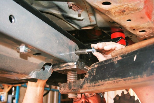 threading a bolt into a frame part