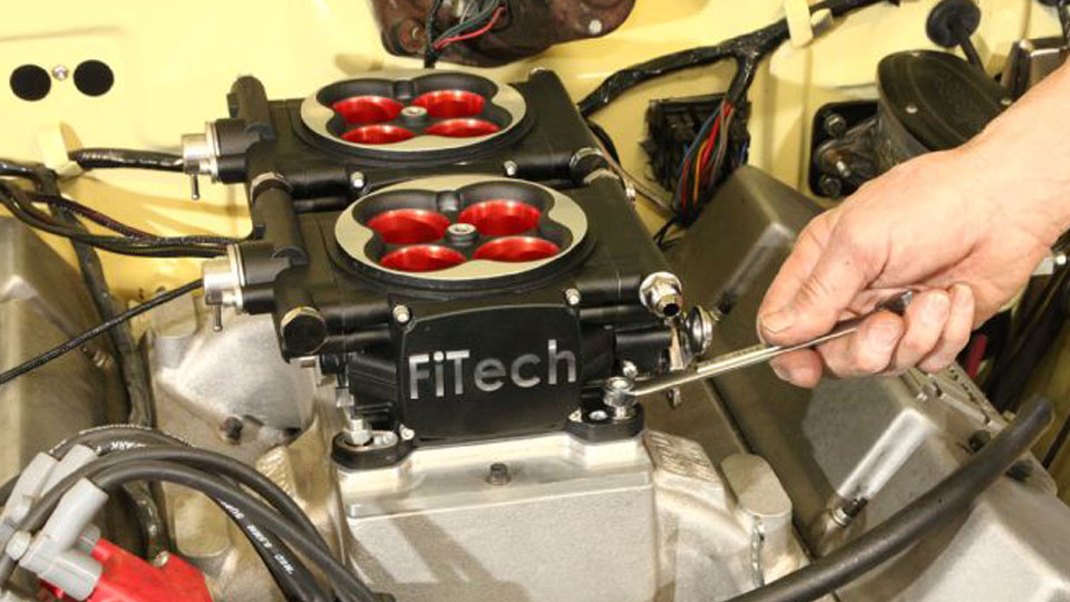 bolting down a fitech throttle body efi module on a v8