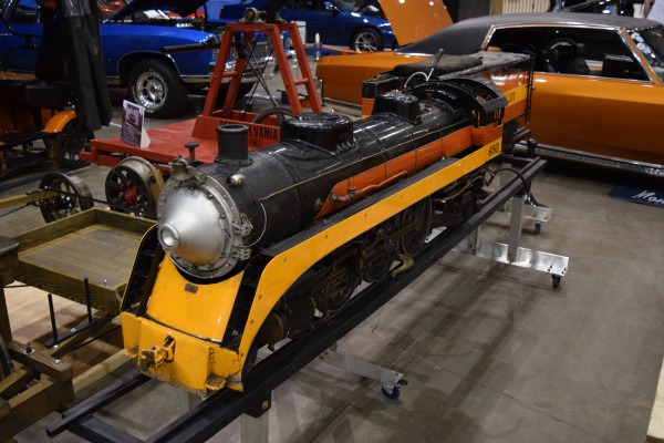 ini southern pacific daylight miniature steam train on display at classic car show