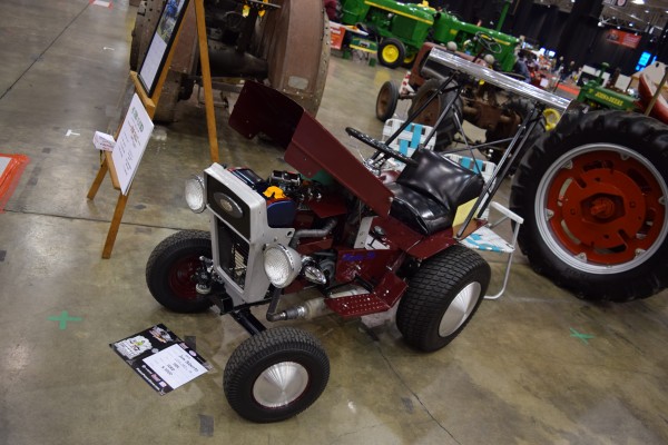 vintage lawn tractor mower at a classic car show