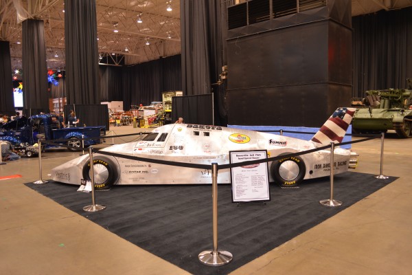 side view of an ecta land speed racer at a car show