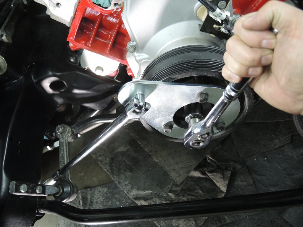 assembling crankshaft pulley removal tool on workbench