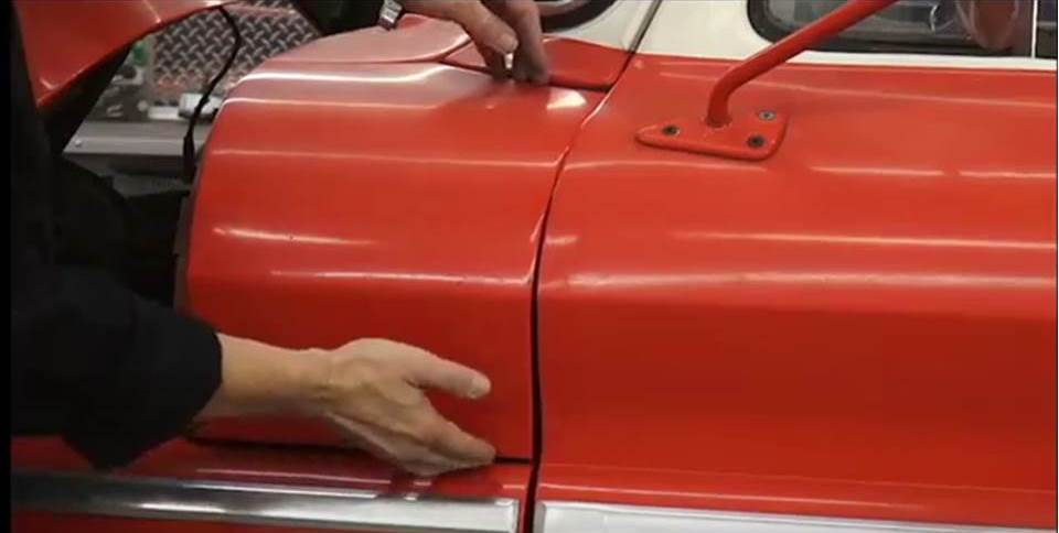 kevin tetz aligning a body panel on a classic truck