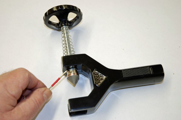 man adjusting fitting on a line lapping tool