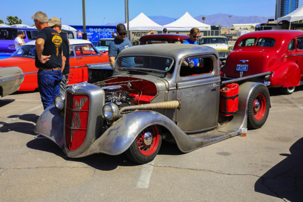 lowered rat rod truck with jerry can