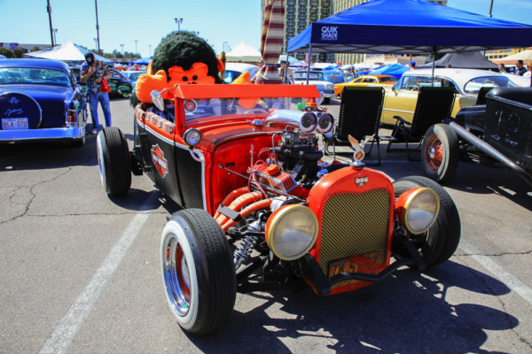 harley davidson themed hot rod at a car show