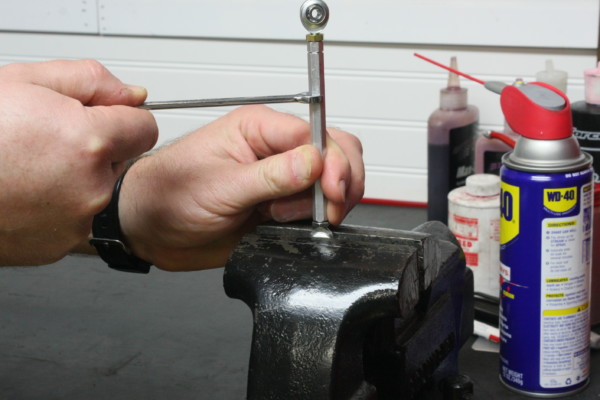 tuning a throttle shaft for size in a bench vise