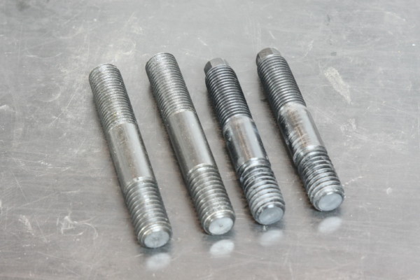 blower studs on a metal workbench