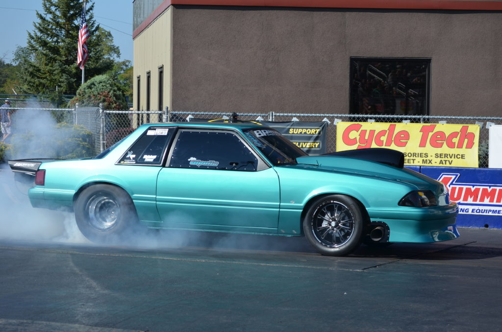 Shakedown at the Summit Teal Mustang