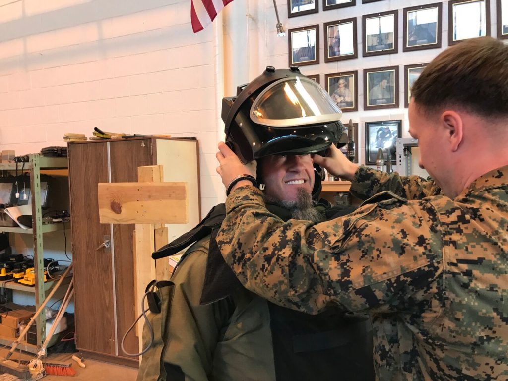 man tries on military bomb disposal suit