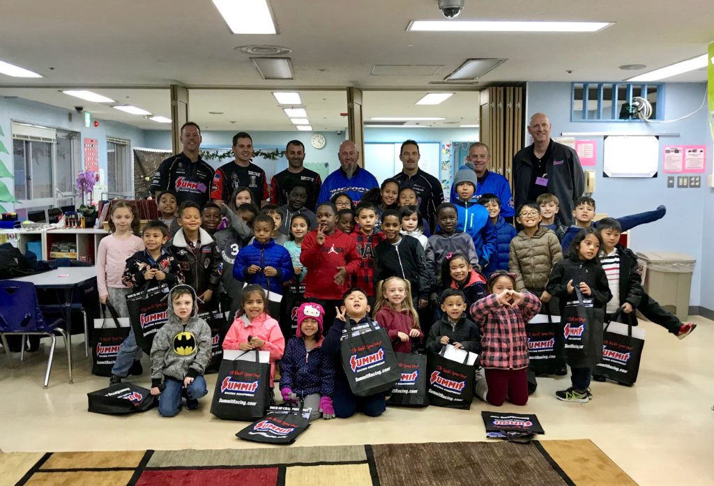 summit racing drivers with children at japanese airbase