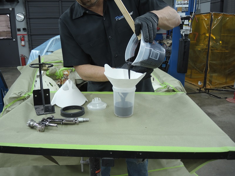 strain mixed primer into paint spray gun