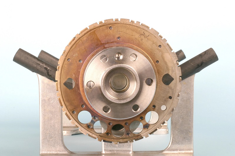 close up of an engine reluctor wheel installed on a crankshaft