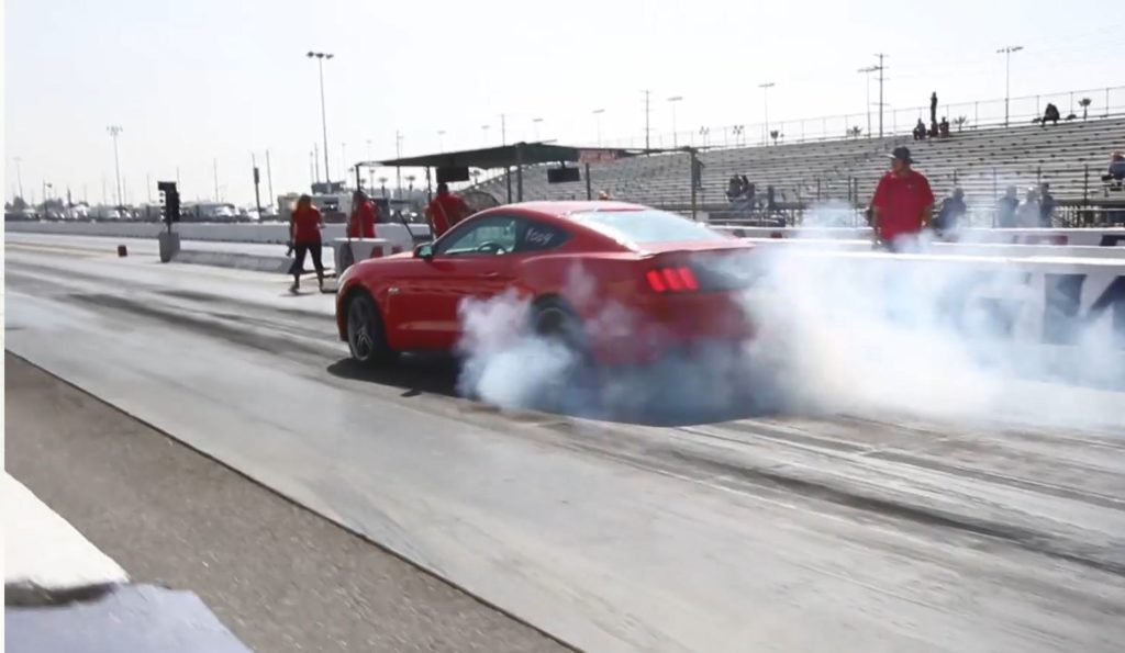 Mustang doing burnout during HP Wars on Strip