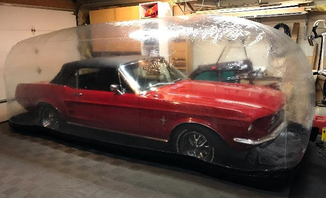 Car Capsule holding a Vintage Mustang
