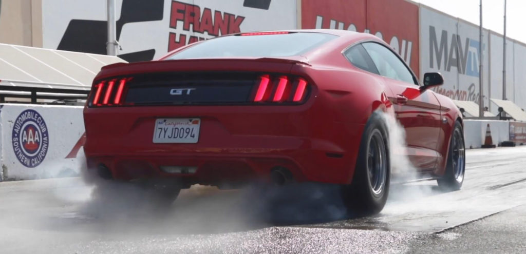 ford mustang gt s550 doing a burnout at a track