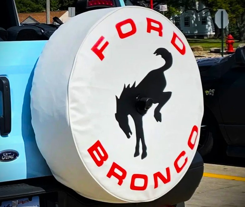 close up of a bronco logo on a spare tire cover