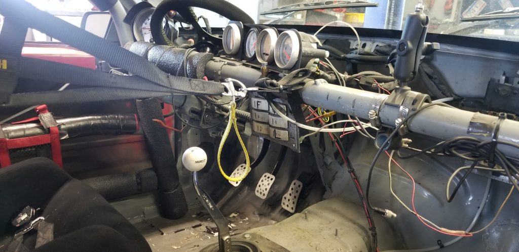 roll bar mounted gauges in fox body mustang race car