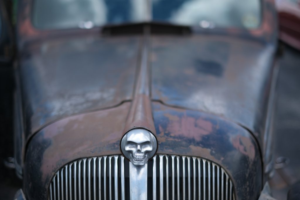 skull emblem on hood of an old car