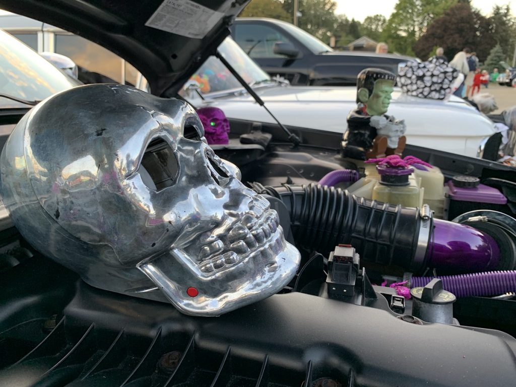 a skull and Frankenstein monster on an engine bay