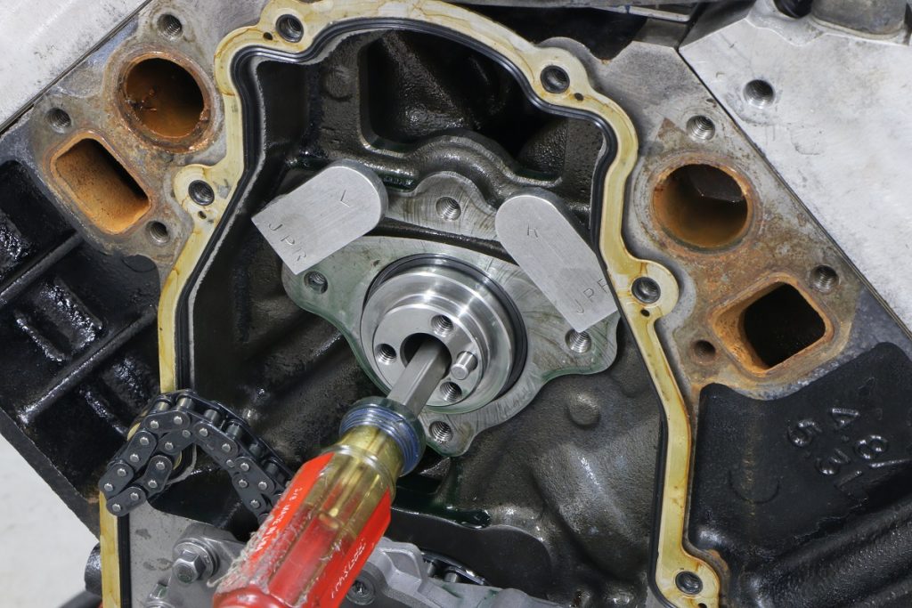 screwdriver placed in center of camshaft to ease install