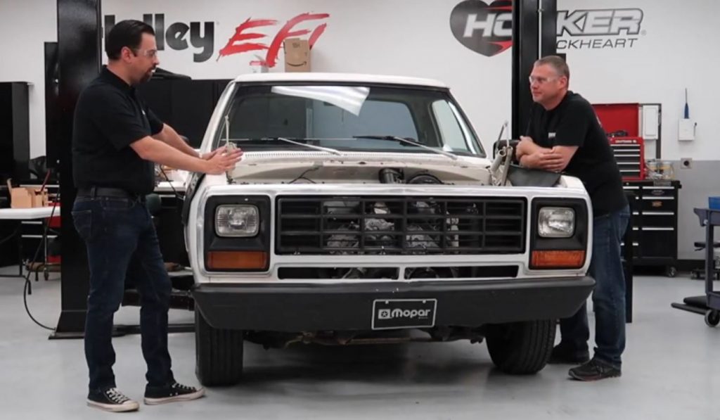 two men begin to swap an gen 3 hemi engine into an old dodge ram truck