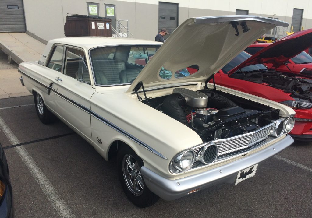 1964 white ford fairlane 427 with its hood up