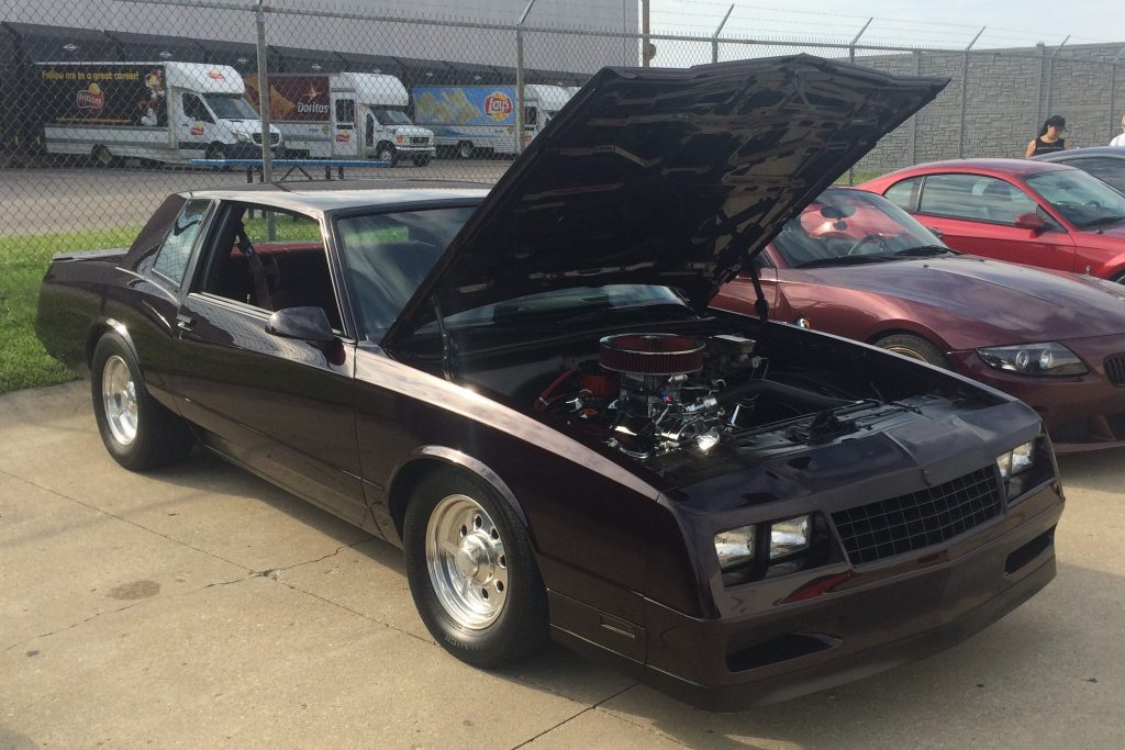 chevy monte carlo ss g body at car show with hood up