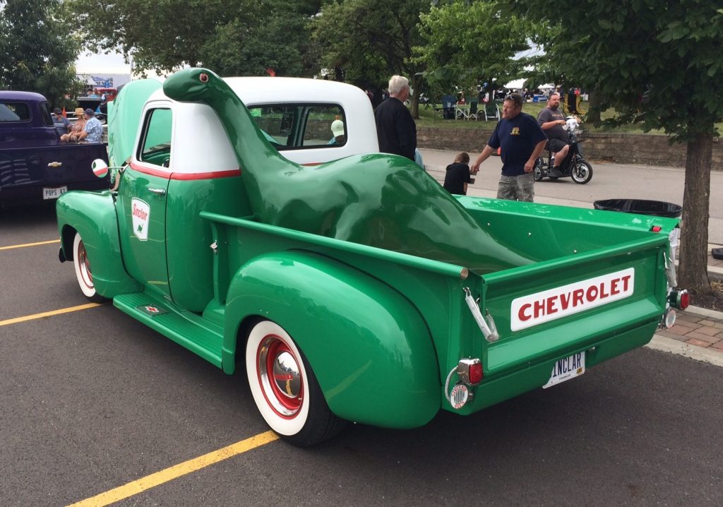 sinclair dinosaur in vintage chevy 3100 pickup truck