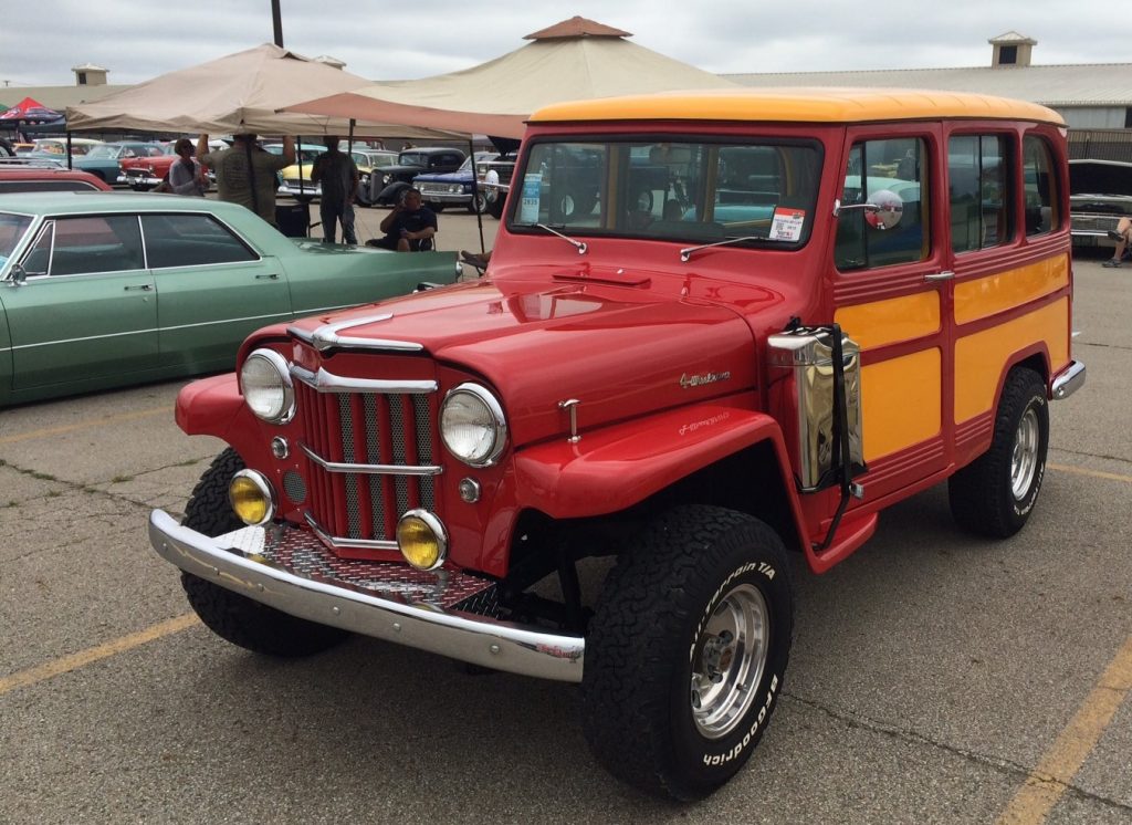 vintage willys woody wagon with jerry can
