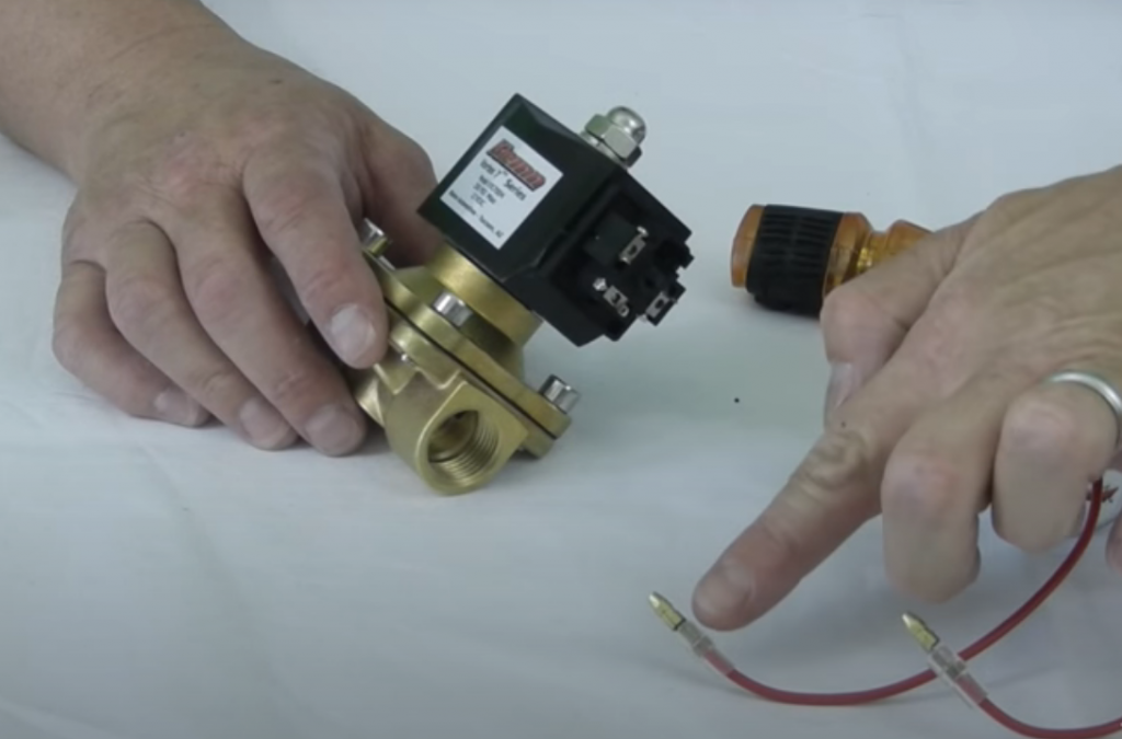 solenoid valve being inspected on a table