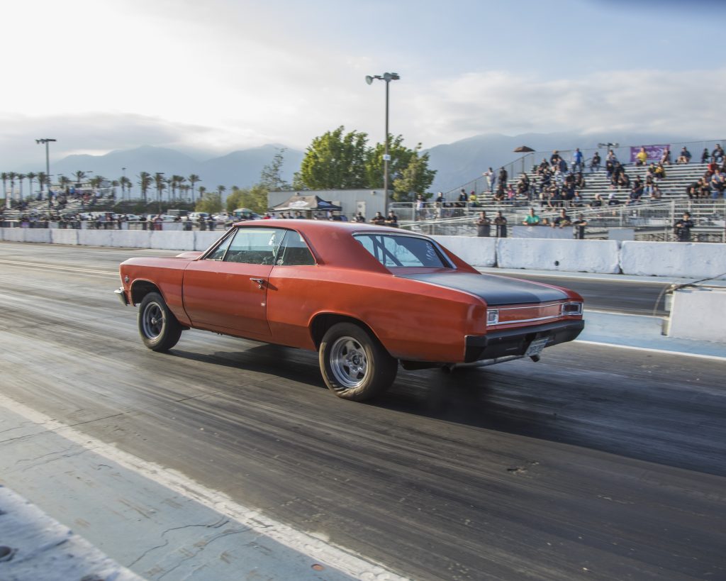 1966 chevelle launching at a dragstrip