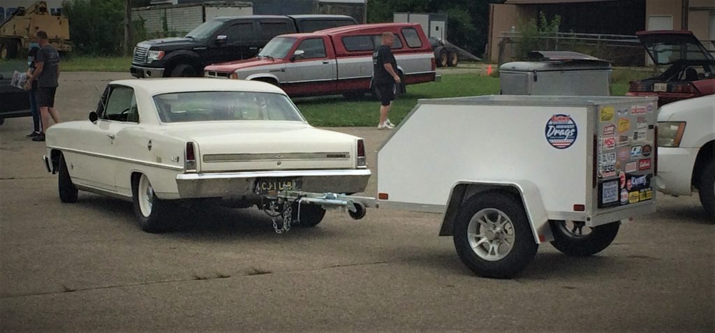 chevy 2 nova pulling a trailer during the summit racing midwest drags event at edgewater sports park in cincinnati ohio