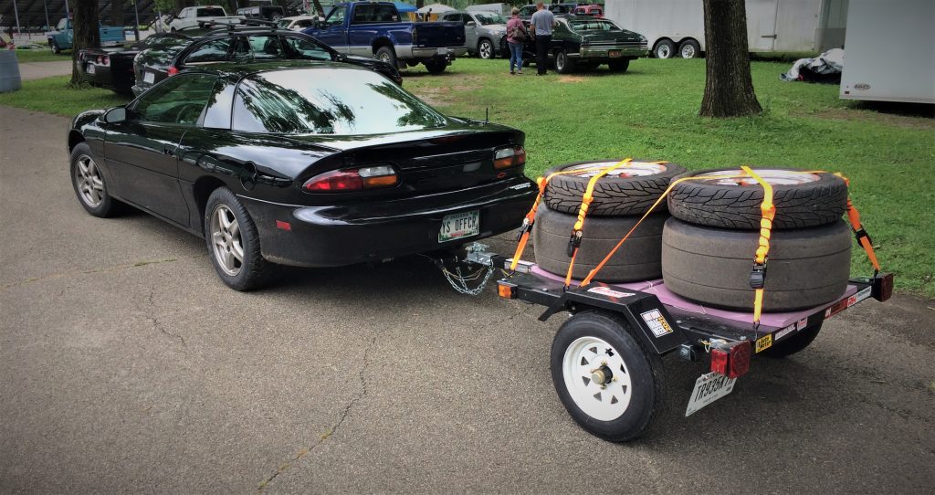 forth generation camaro pulling trailer with race tires during the summit racing midwest drags event at edgewater sports park in cincinnati ohio