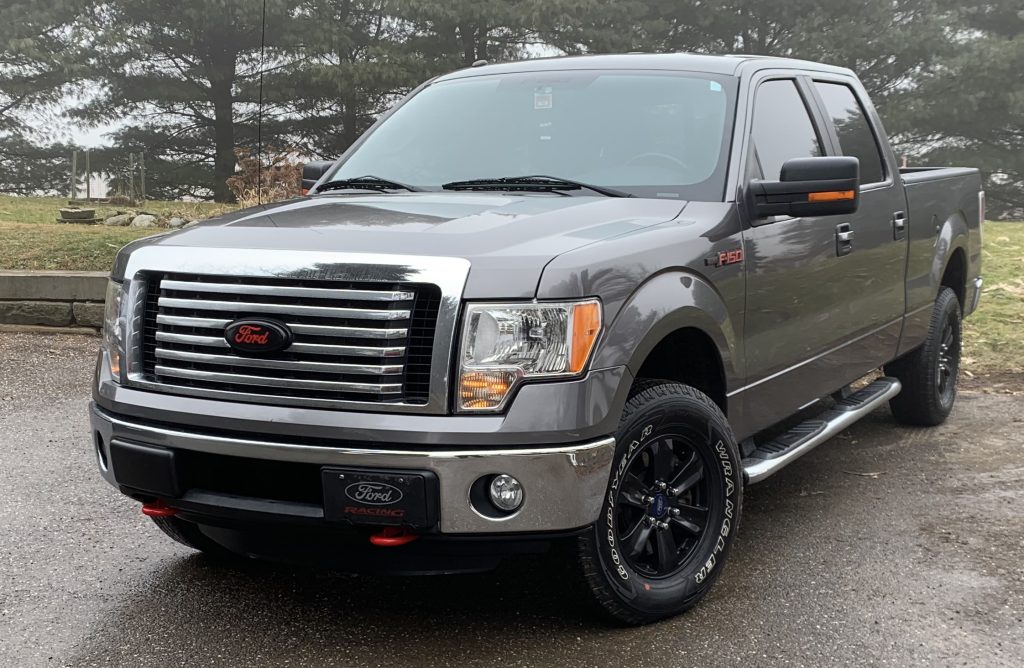 silver grey 2011 Ford F150 Truck in a driveway