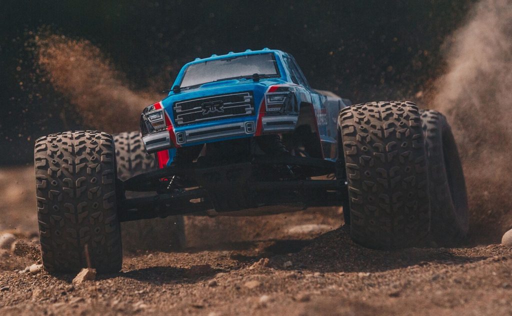 arrma granite rc truck blasting through dirt