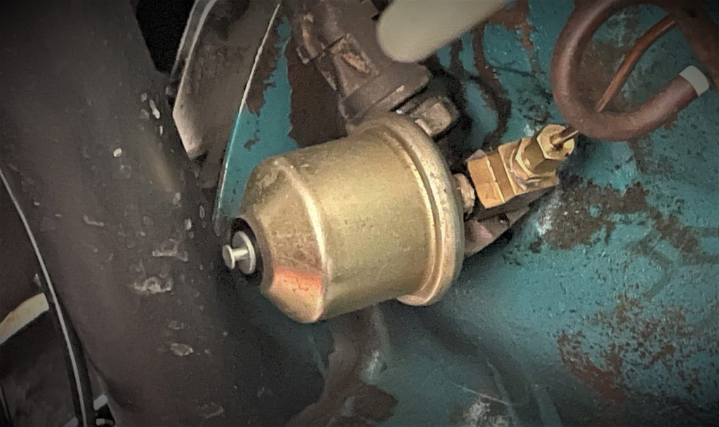 unhooked oil pressure sending unit on an AMC 258 engine 2