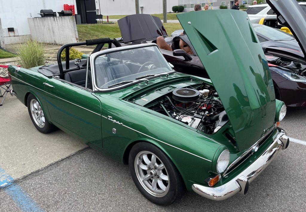 front passenger side quarter view of a sunbeam tiger with its hood up