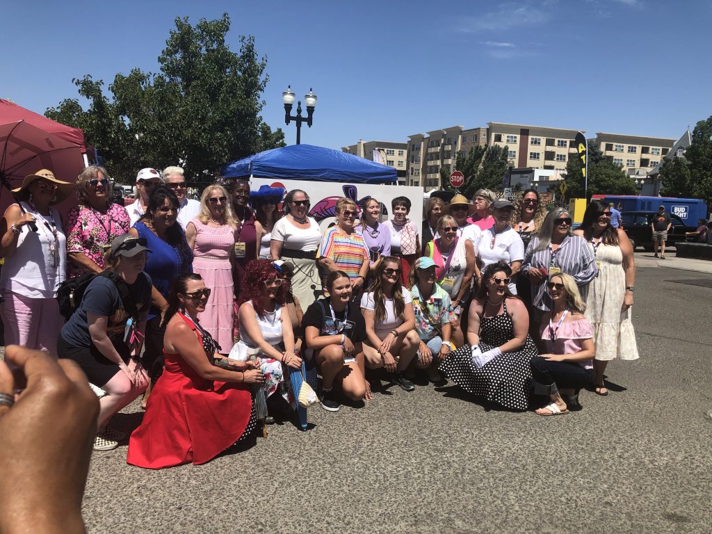 Group of women car builders at a show